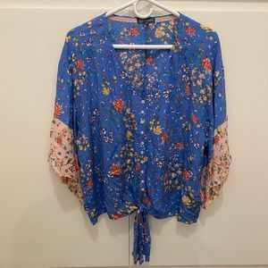 Floral top with tie detail and button front